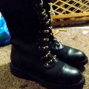 There boots with chains and knee length.